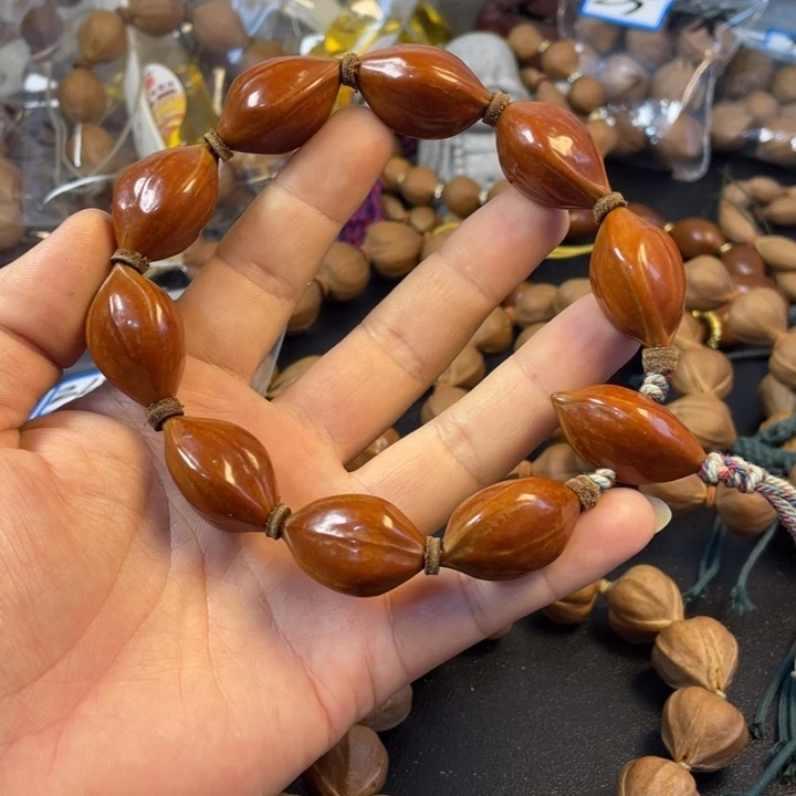 用***尔吊坠橄榄核橄榄核