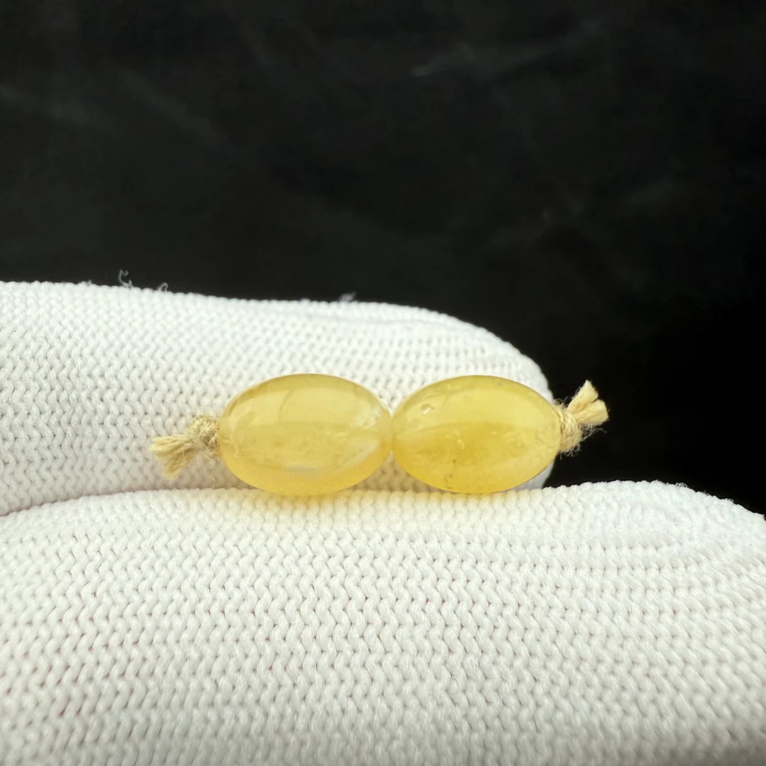 J4953天然矿源蜜蜡 枣珠一对7.7*11.2mm支持复检假一罚十