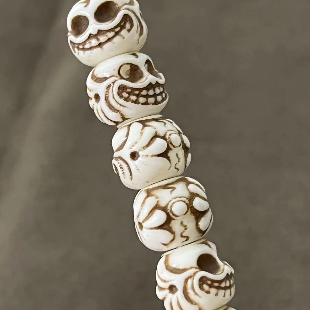 S7235牛骨雕刻尸陀林主对珠腰珠背云文玩饰品