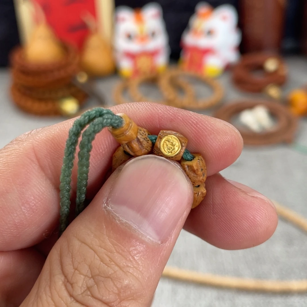 赵***美柏香籽/百香籽吊坠金标