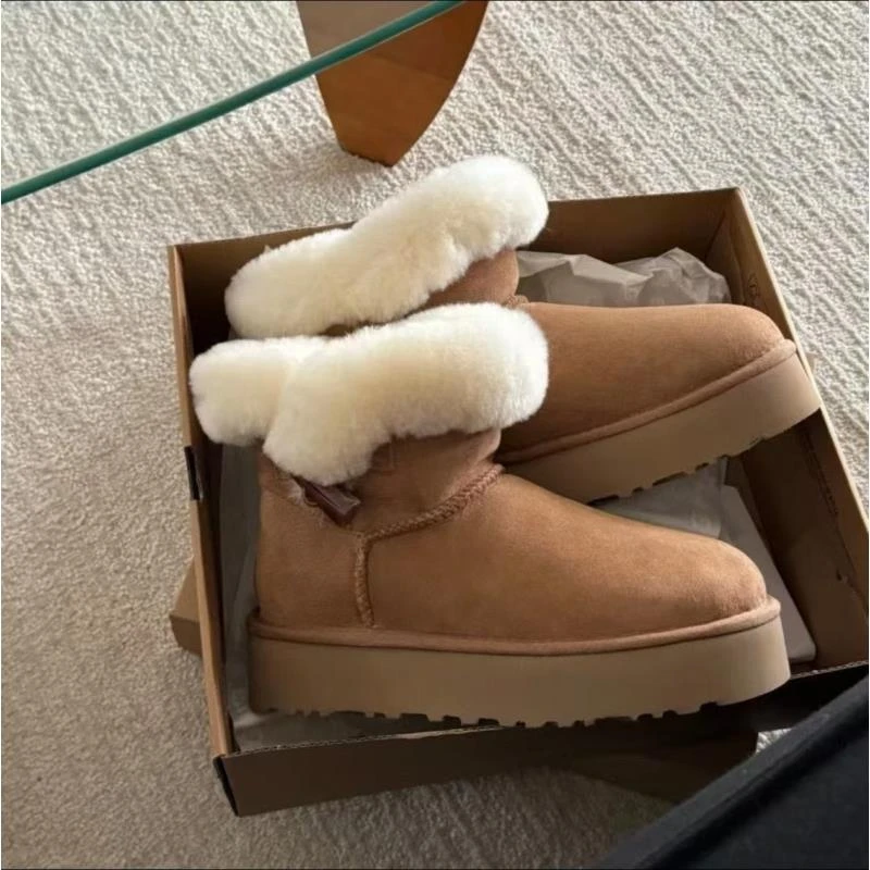 一粒牛角扣羊皮毛一体女士百搭防滑耐磨雪地靴