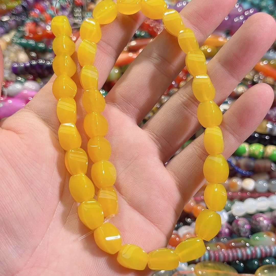 玛瑙/玉髓未镶嵌珠宝半成品黄玛瑙妞妞珠一条8x11mm