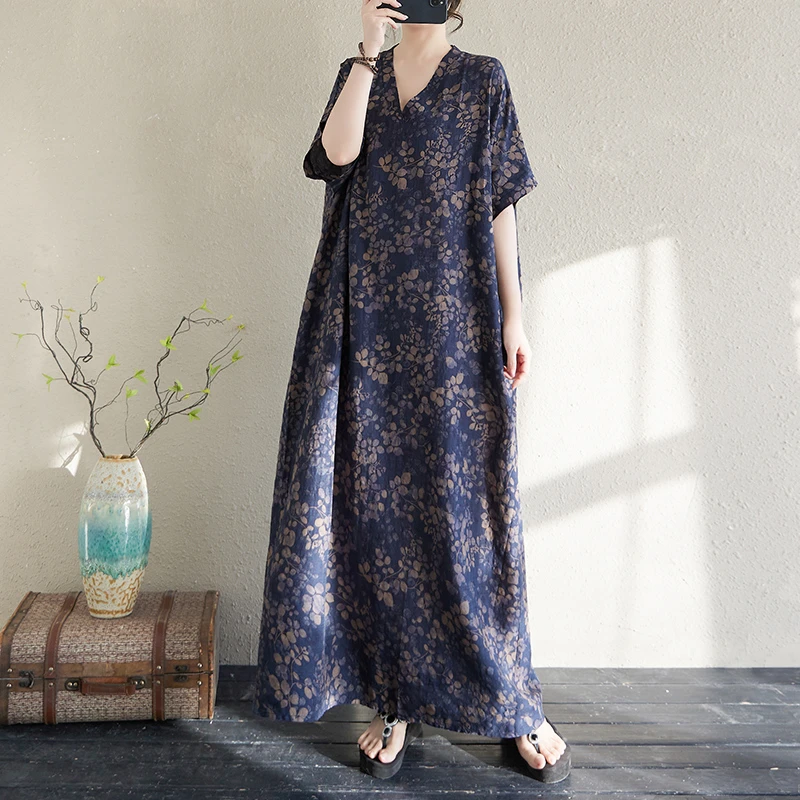 高端减龄女2025夏季款棉麻印花V领宽松大码连衣裙简约度假风长裙