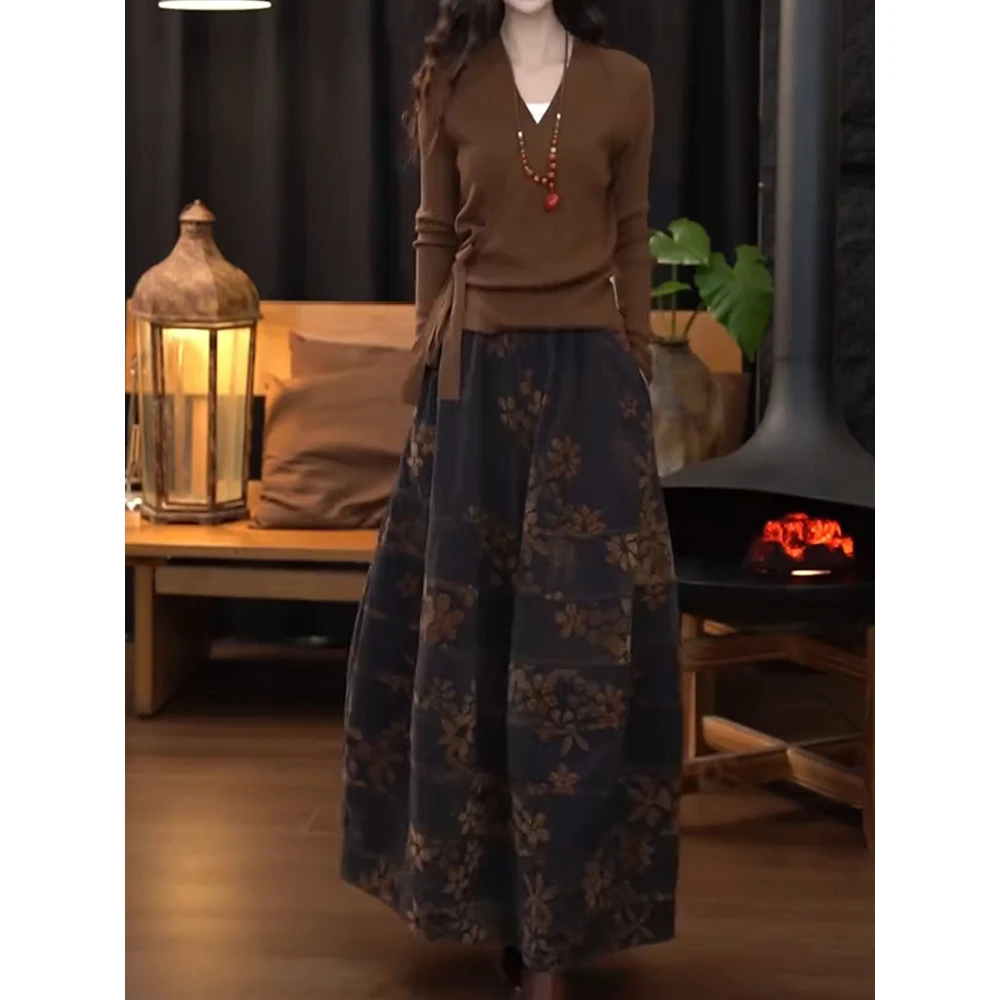 漂亮出片衣服套装女款爆款2025新高级时尚交叉v领针织衫印花半裙