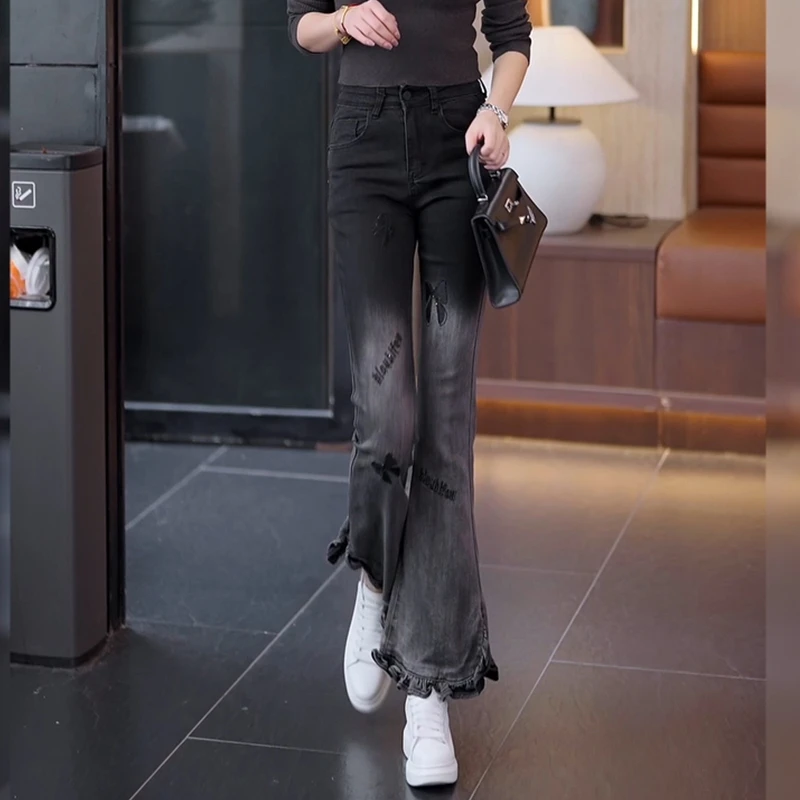 高腰修身刺绣2025春秋冬修身渐变色花边波浪开叉设计微喇叭牛仔裤