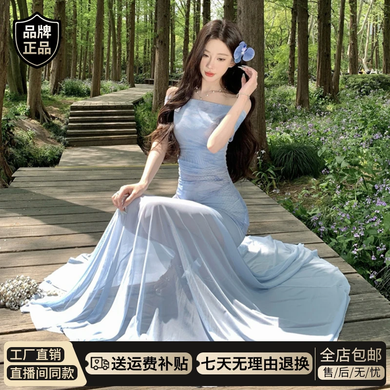蓝色一字肩薄纱连衣裙子女夏季爆款2026新款海边度假包臀鱼尾长裙