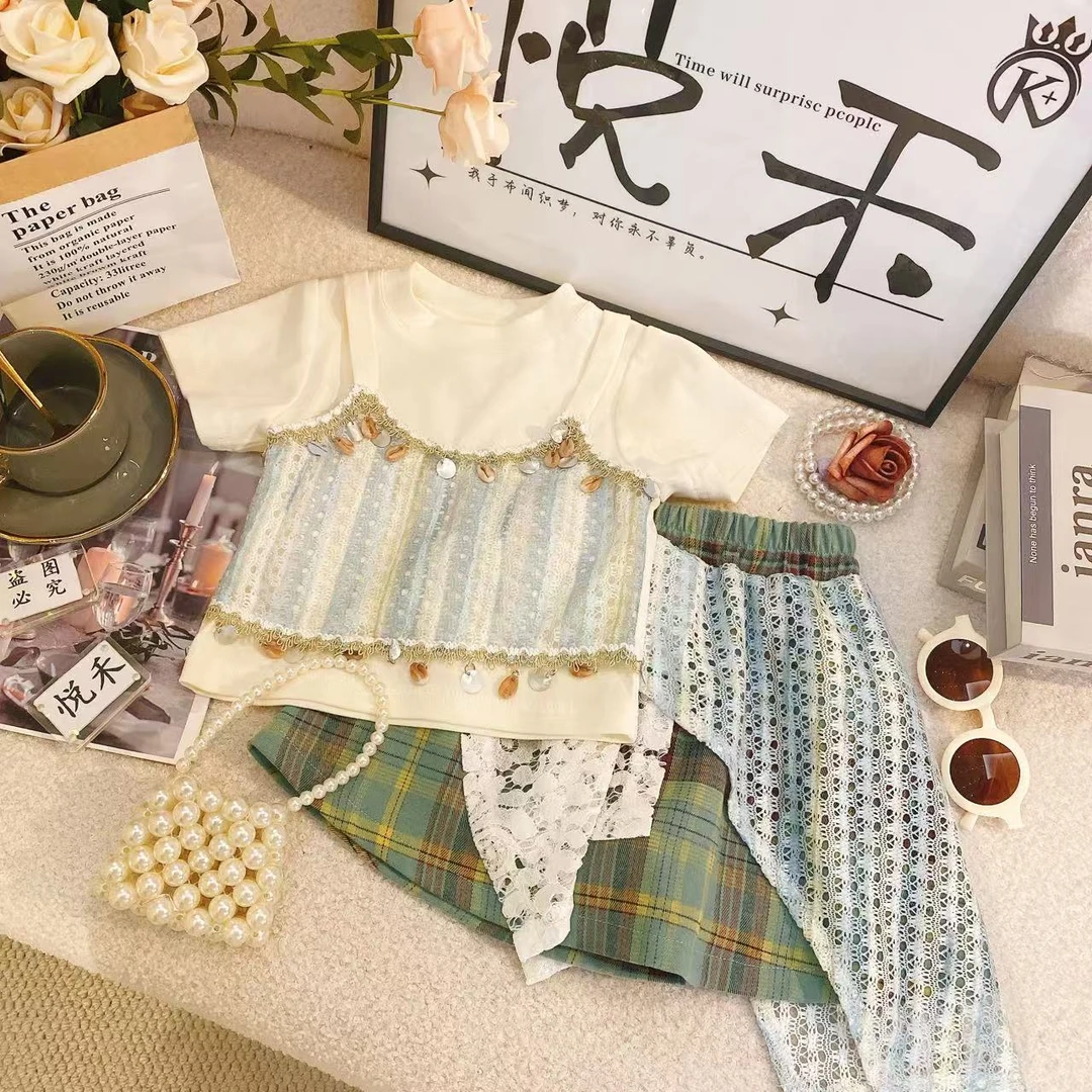T2女童短袖半身裙2025夏款波西米亚流苏镂空背心不规则格子裙8791
