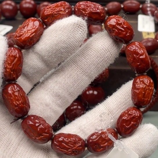 咯***局橄榄核吊坠橄榄核