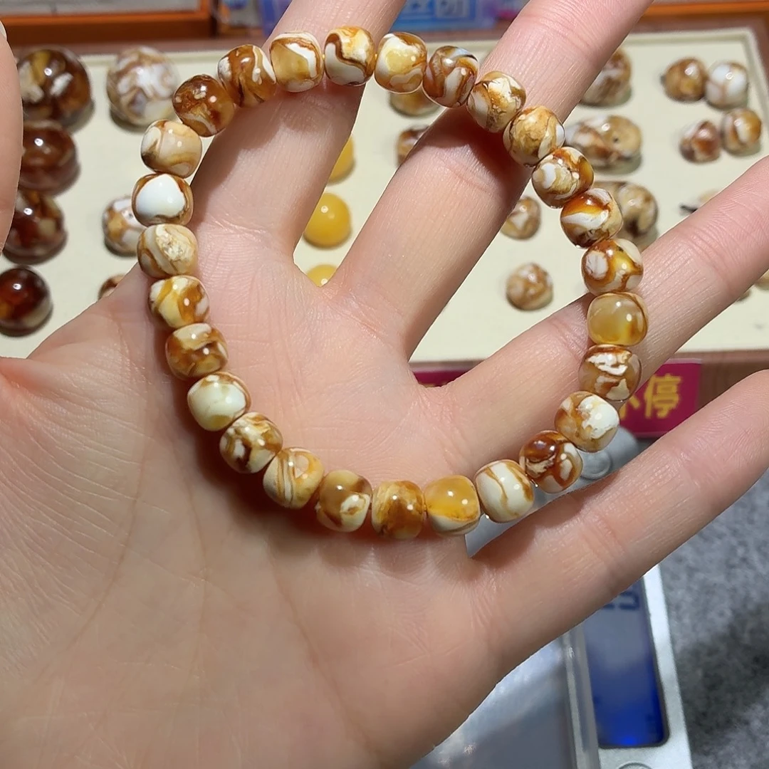 风***浪桃核吊坠沁色老型手串