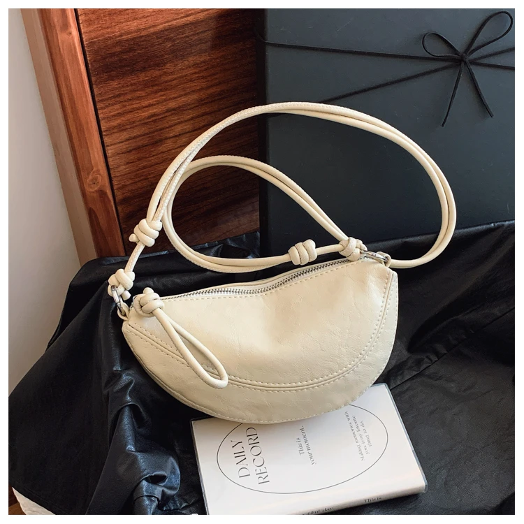 小豌豆包女高级2025年春夏新款斜挎包腋下半月包水壶包韩版牛角包