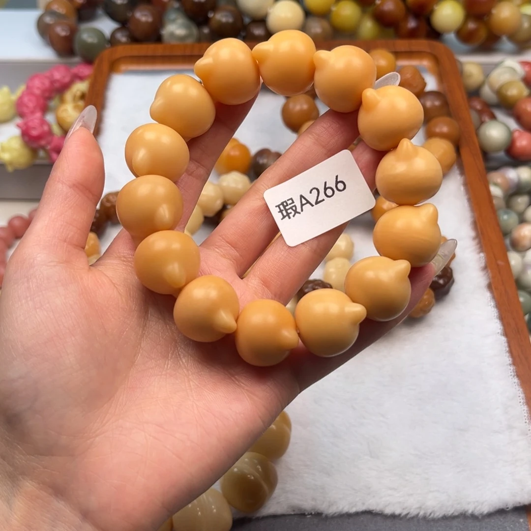 菩提根/象牙果手串会**橙瑕a266猫头一串19