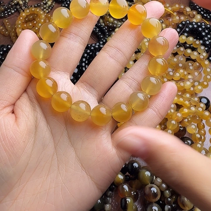 顺***水木质类驴蹄子蜜色1.2手串