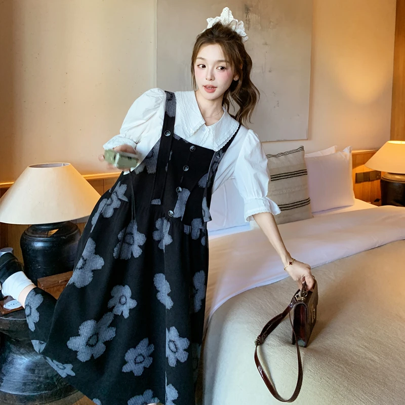 黑色设计感气质花朵印花背带裙女2025春季新款韩系休闲显瘦A字裙