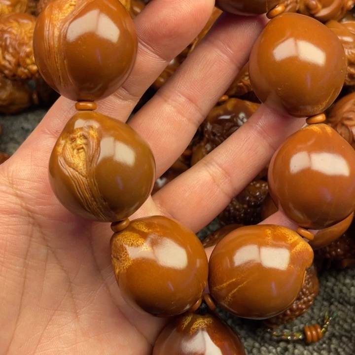 橄榄核吊坠好*怜橄榄核手持