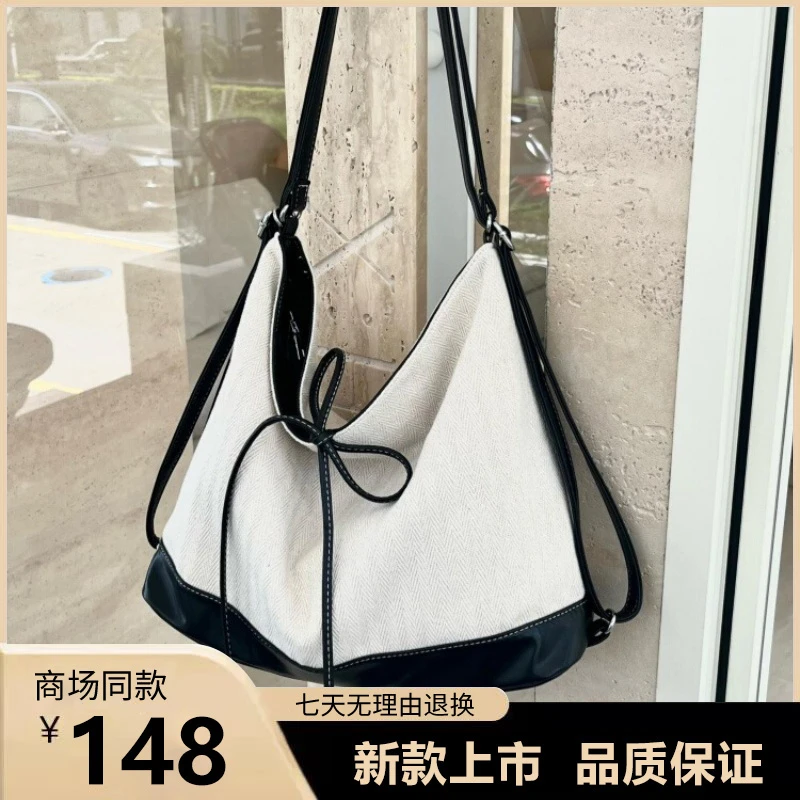 韩国大容量帆布包包女式2025新款潮学院风托特包休闲单肩水桶包