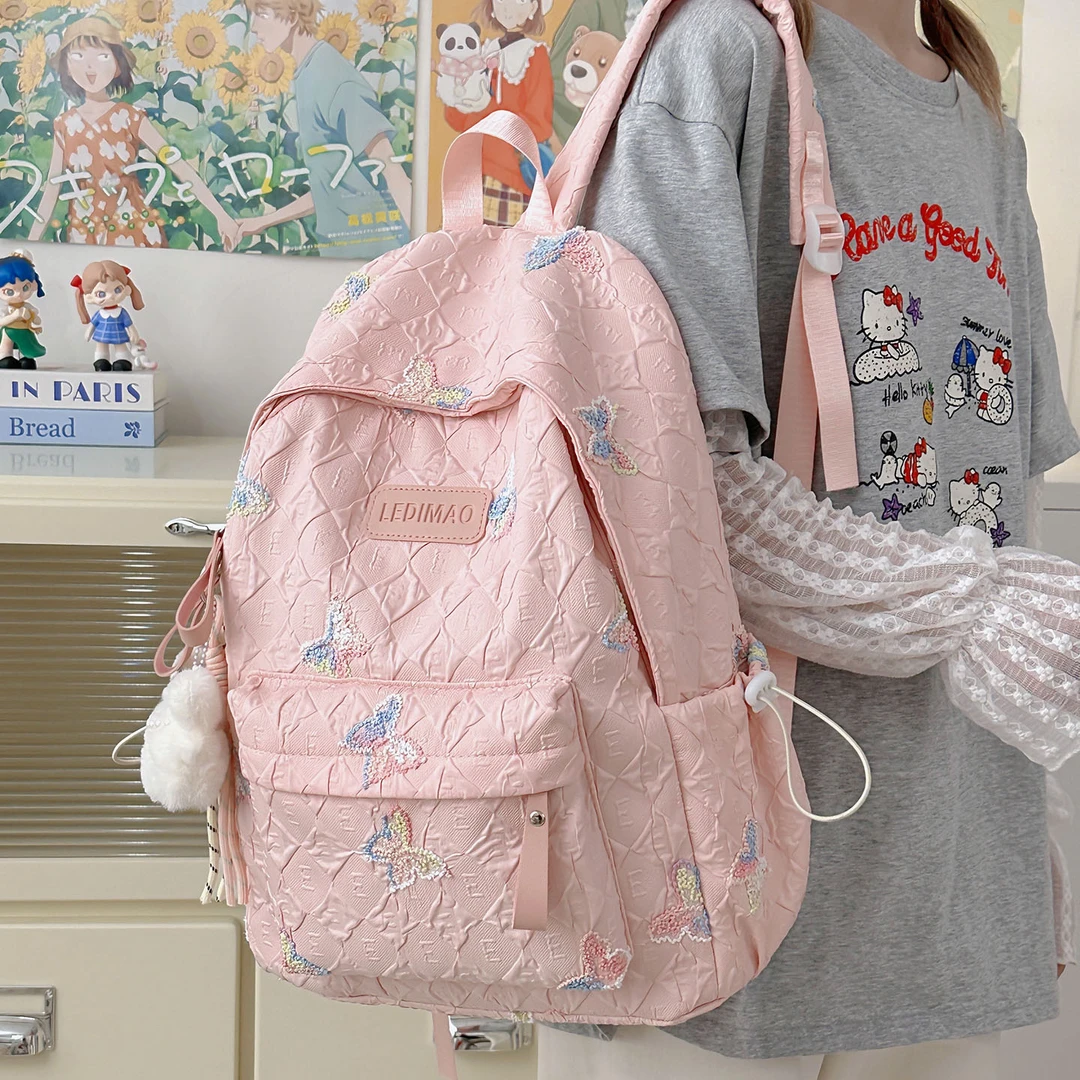 儿童书包女生小学生2025新款初中生女孩可爱格子背包高颜值双肩包