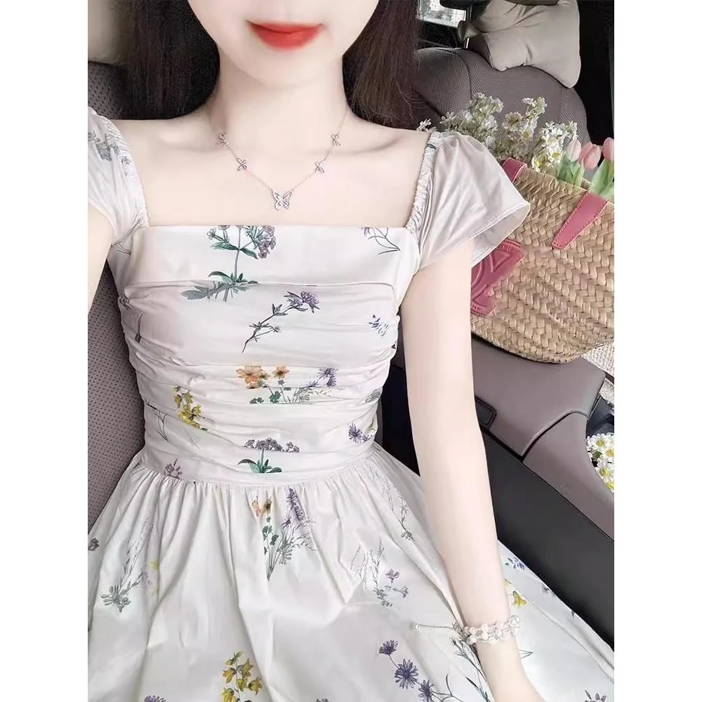 大码独特白色碎花连衣裙夏季超好看茶歇法式收腰长裙子