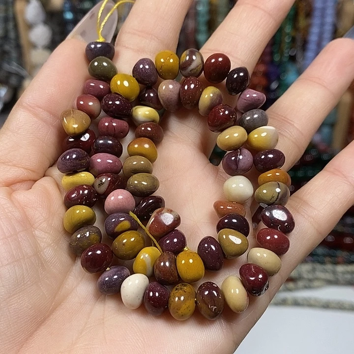 玛瑙/玉髓未镶嵌珠宝半成品天然蛋黄石糖豆一条