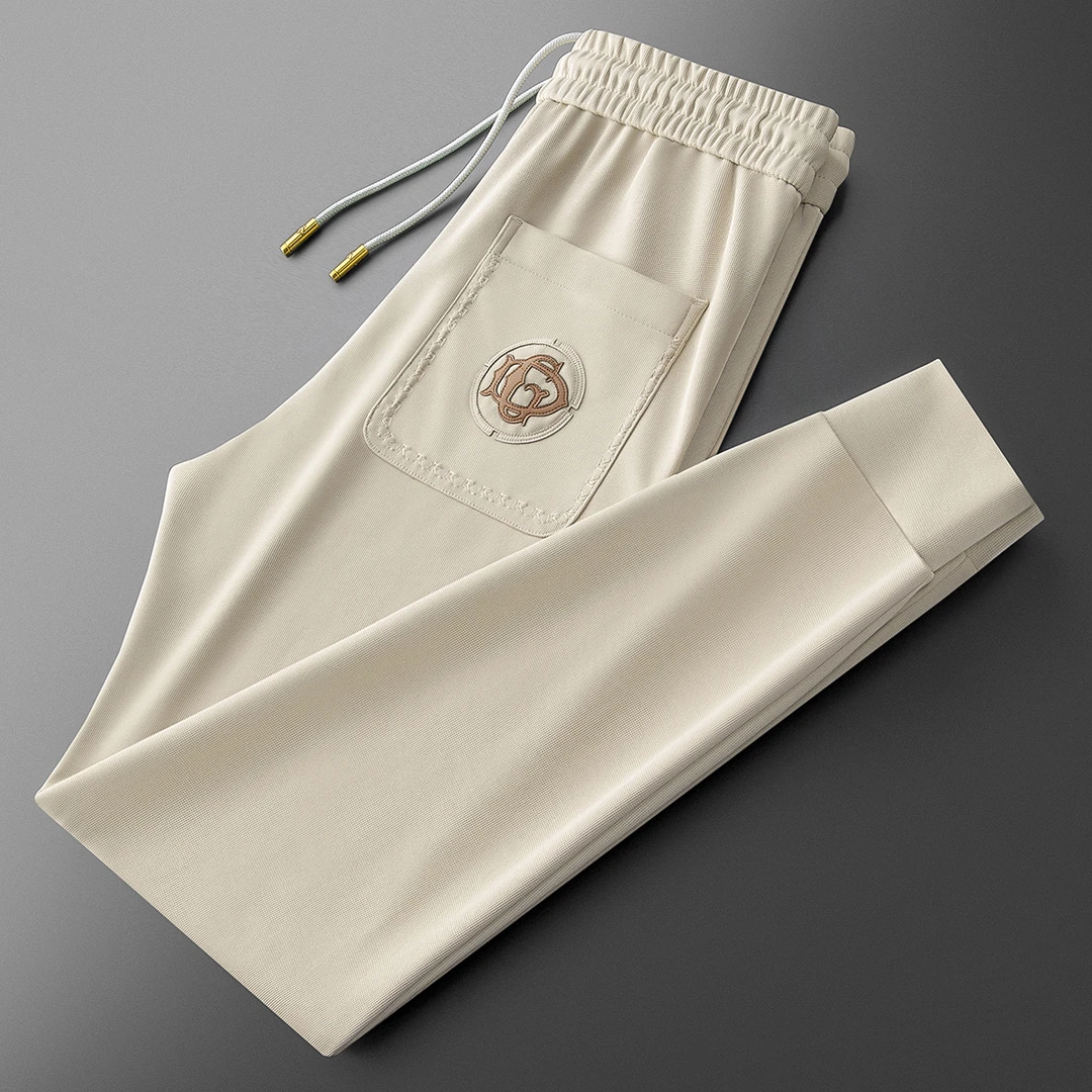 EOENKKY秋季高端时尚潮流弹力抗皱华夫格提花男刺绣运动小脚卫裤