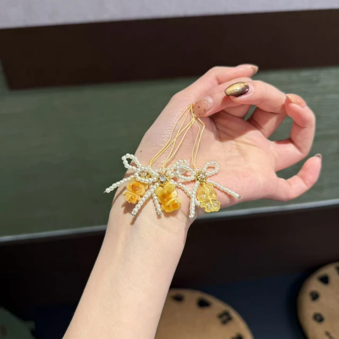 *蝴蝶小熊*天然蜜蜡蝴蝶结手机挂 多样性发其一