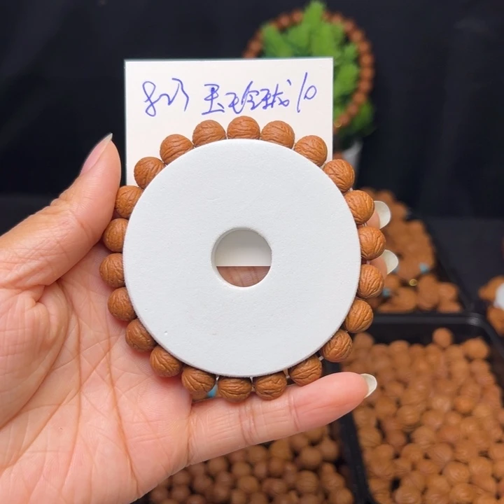 桃核把件玉玲珑10手串