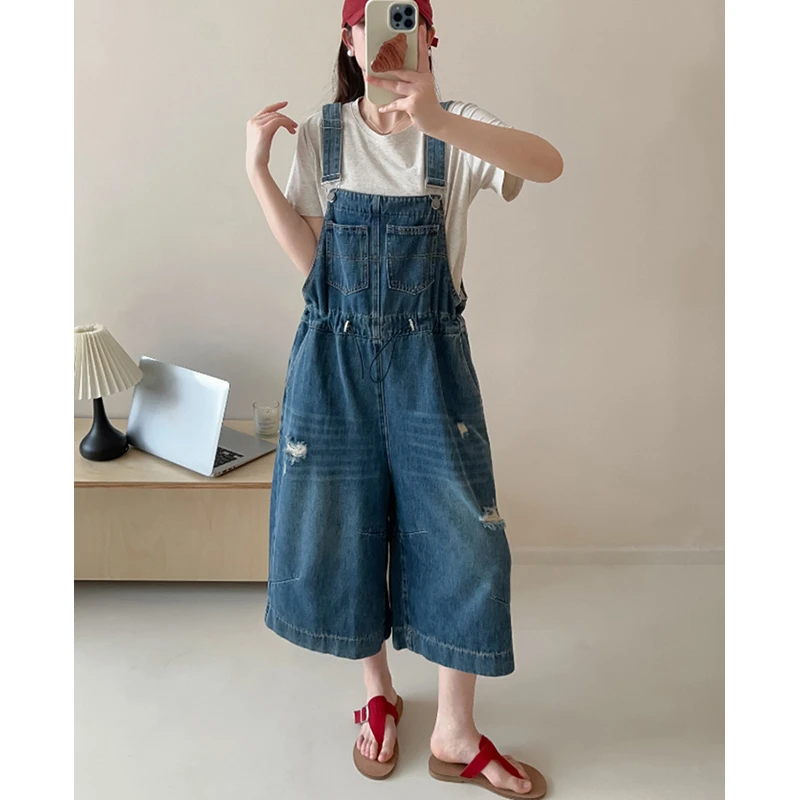 蓝色背带裤女2025夏季新款欧货工装八分阔腿裤宽松休闲牛仔连体裤