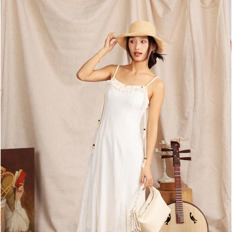 西町村屋度假流苏编织吊带裙女春季新款气质长款连衣裙XAAA10533