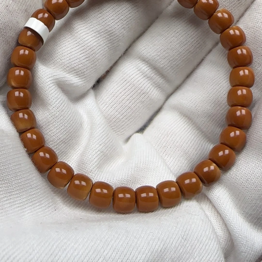 孙***手串橄榄核老挝单圈极限弧三花6.6mm