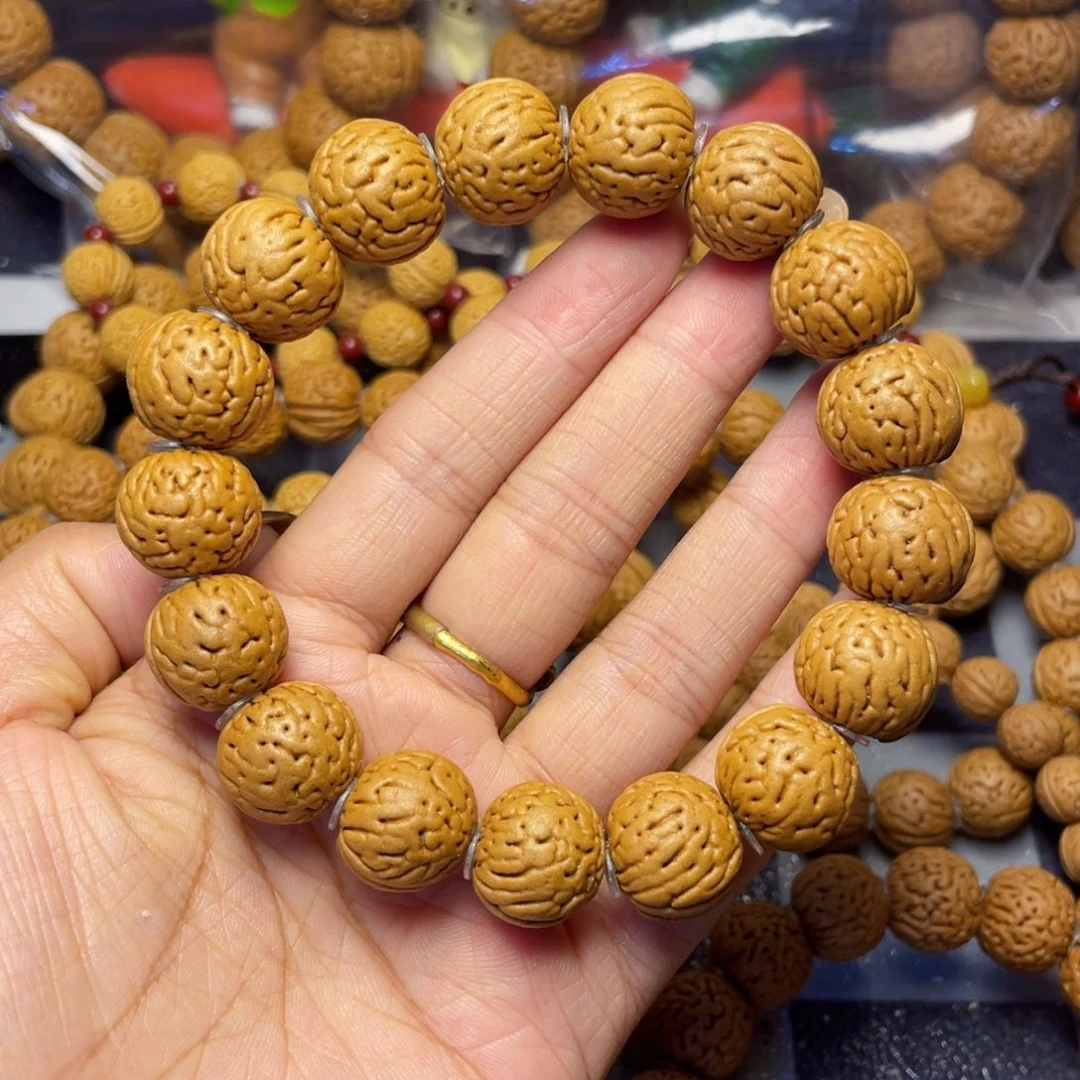 桃核吊坠小**白16金丹手串