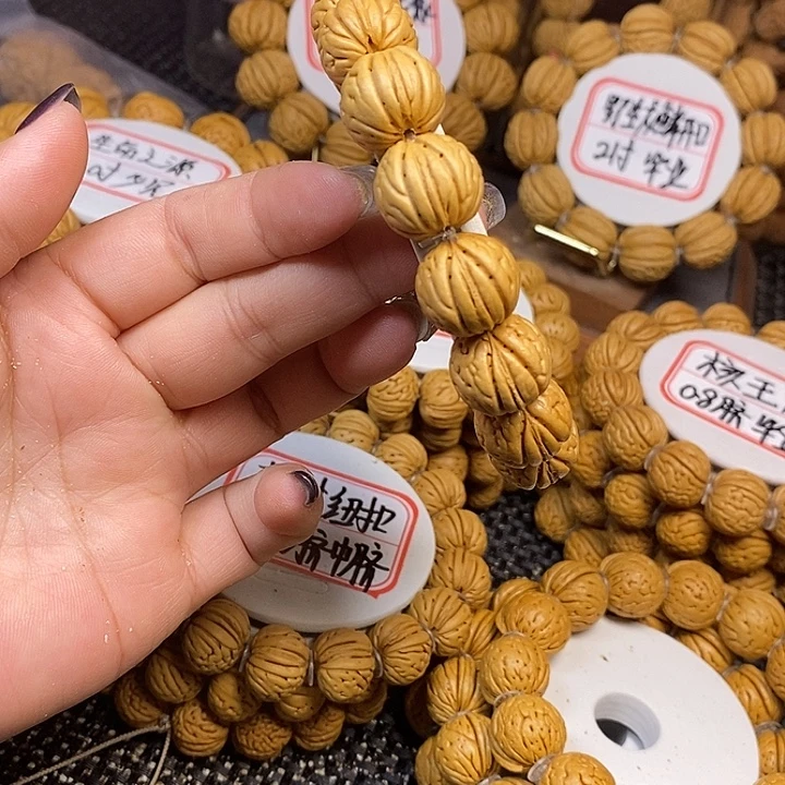 寒***生手串桃核母树金丹1.6