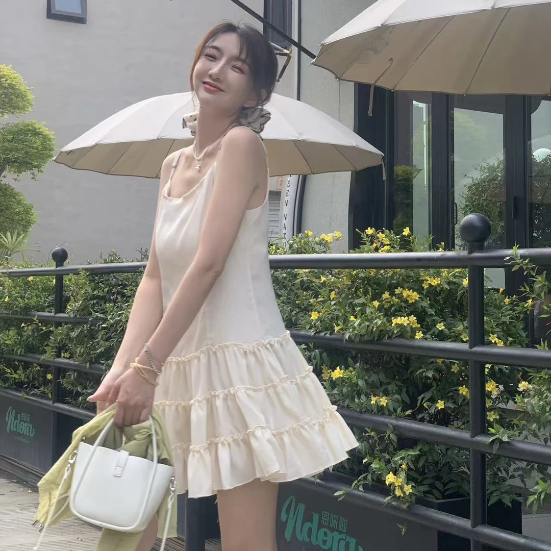 毛小兔2025夏季新款米黄色吊带连衣裙