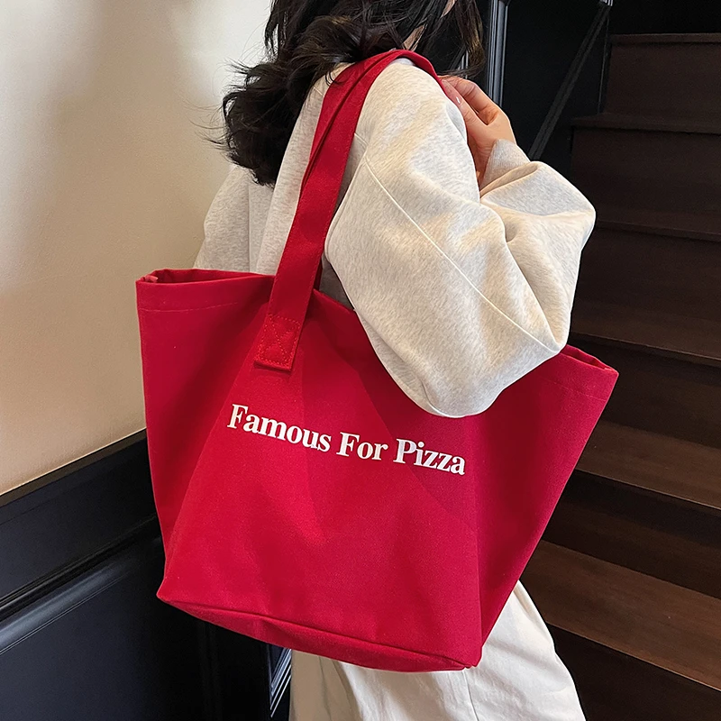 红色字母休闲帆布包包女2025新款潮托特包学生上课大容量购物袋包