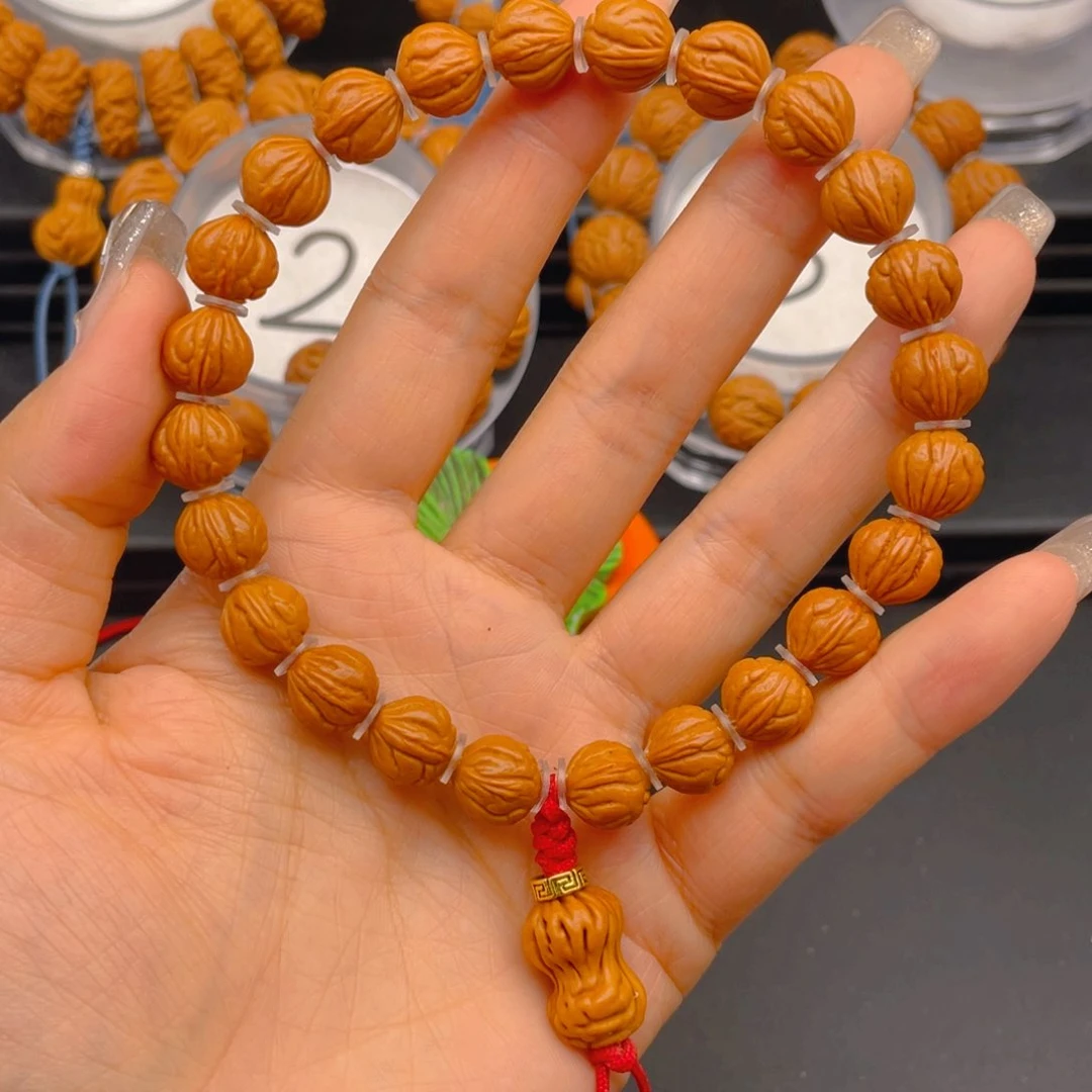 桃核手串打****头见健健康康平平安安9