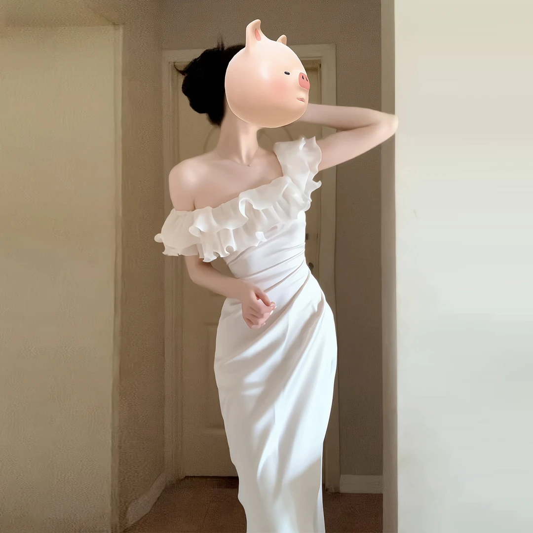 法式白色一字肩连衣裙子女夏2026新款巨好看绝美收腰包臀鱼尾长裙