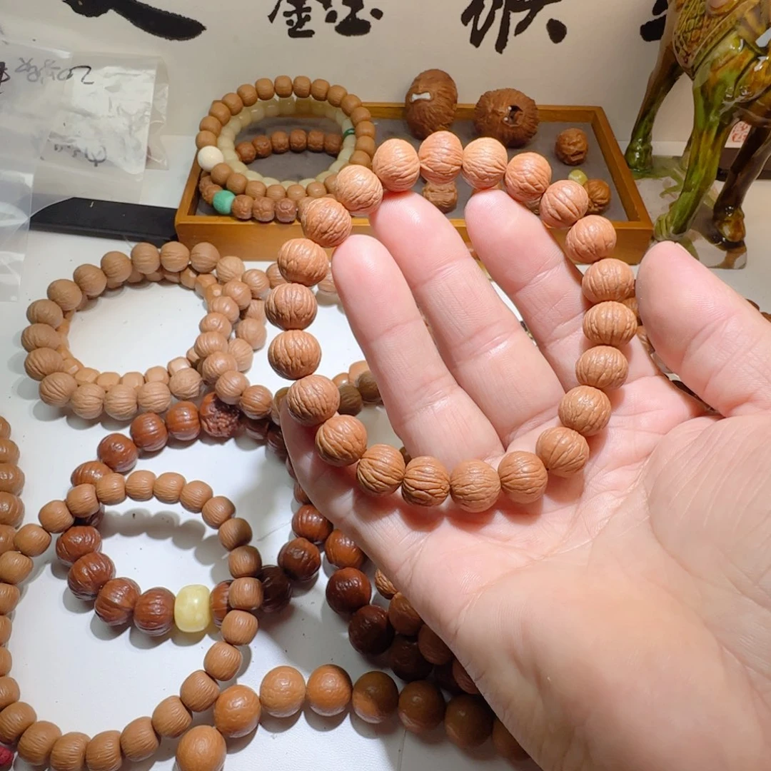 猴头核桃吊坠原皮无修凤羽手持12..5
