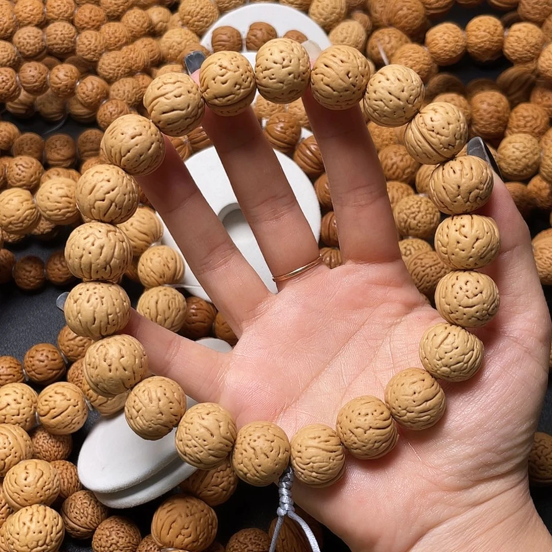 焊***祖手串桃核肉纹元宝