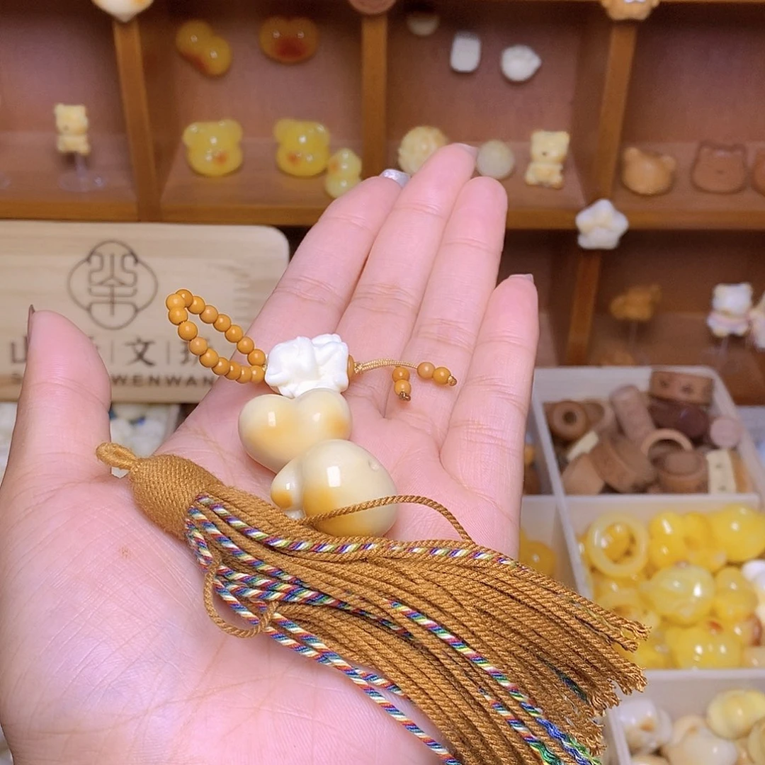 袁***妈猴头核桃吊坠爱心猫爪棕流苏狐狸提溜