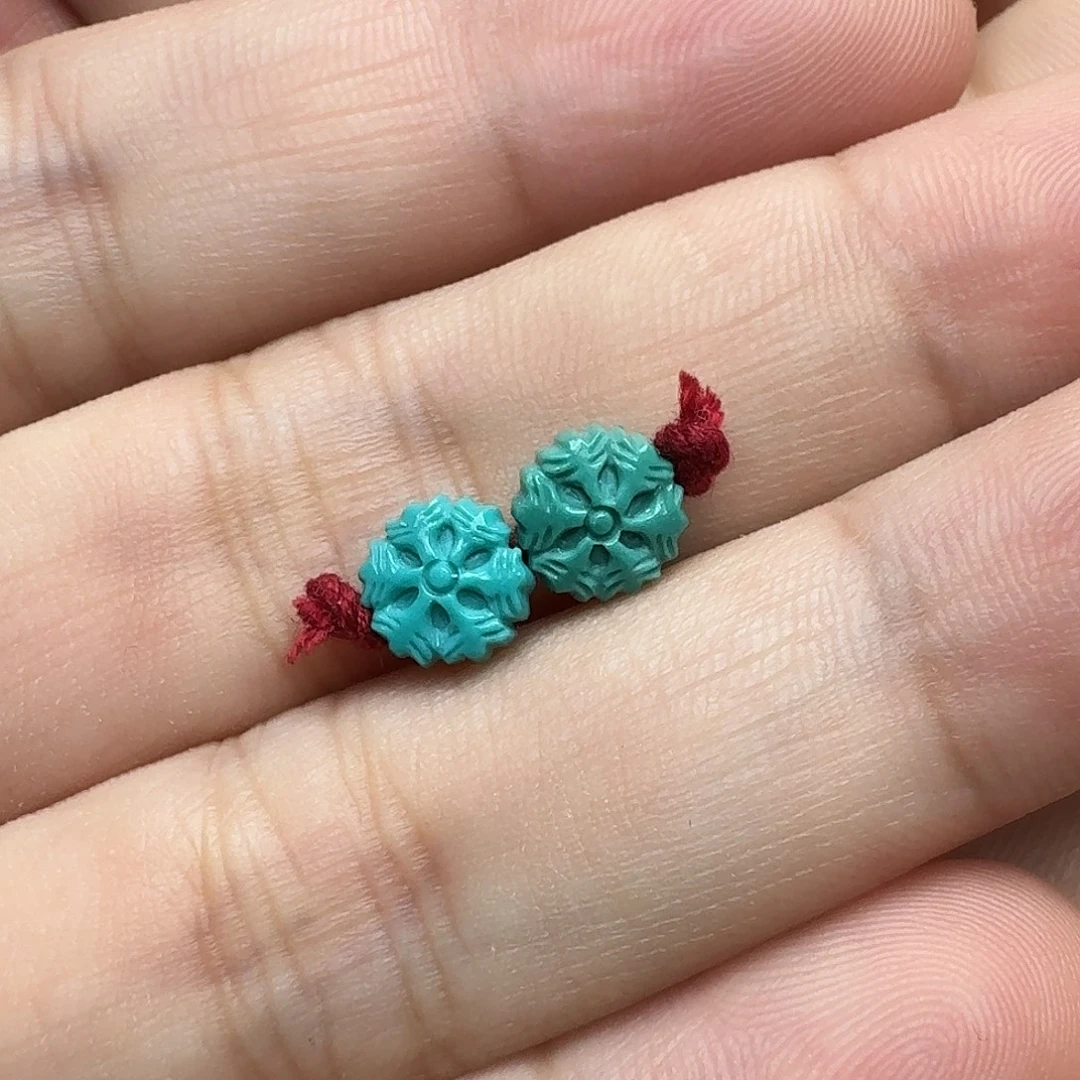 柠***哦未镶嵌绿松石雪花一对