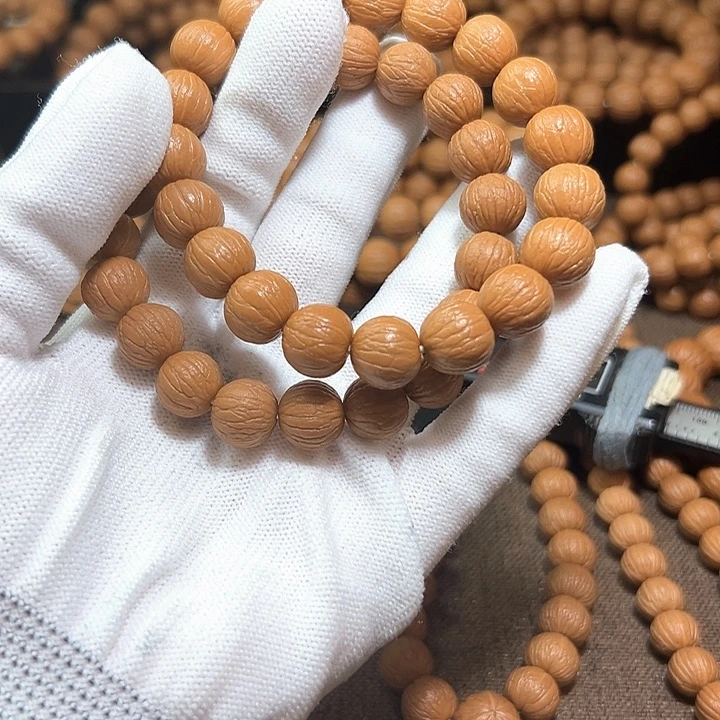 芋***泥手串桃核12聚宝盆，凤羽
