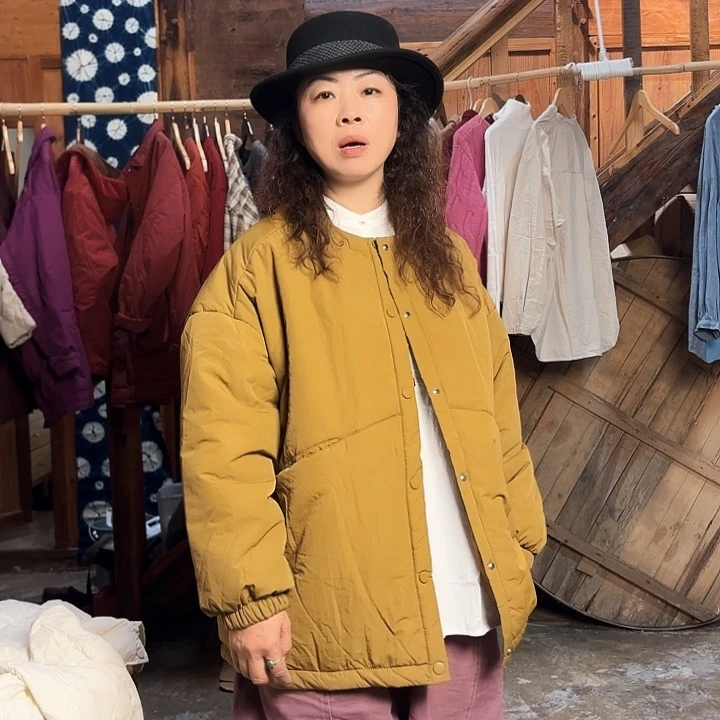 黄绿色棉服中长款棉袄棉服