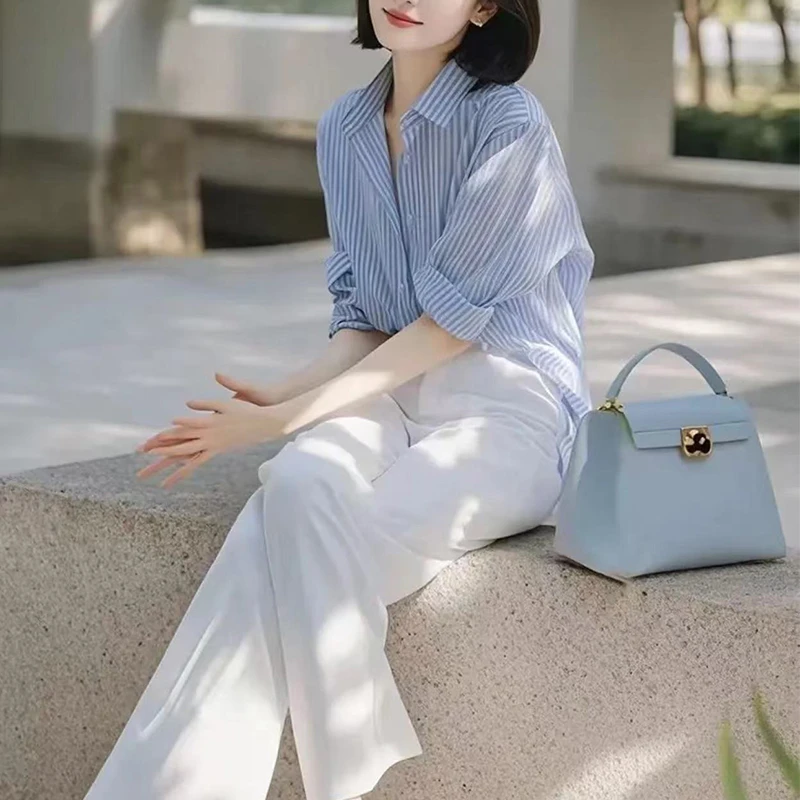 高级感蓝色条纹衬衫女洋气春装2025新款宽松盐系职业休闲雪纺上衣