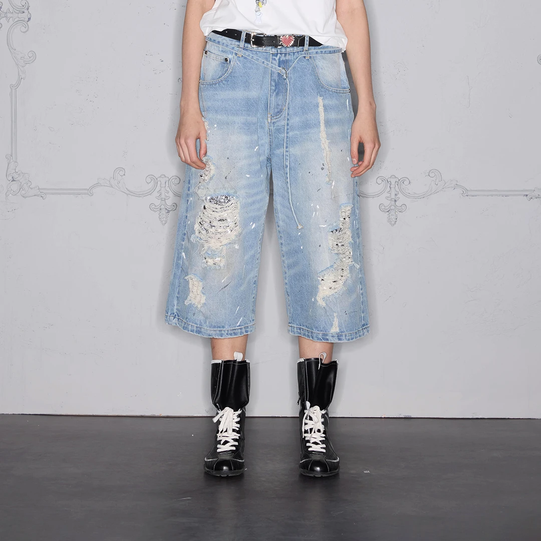 ROCAWEAR 亮片破洞洗水泼墨腰绳七分牛仔裤