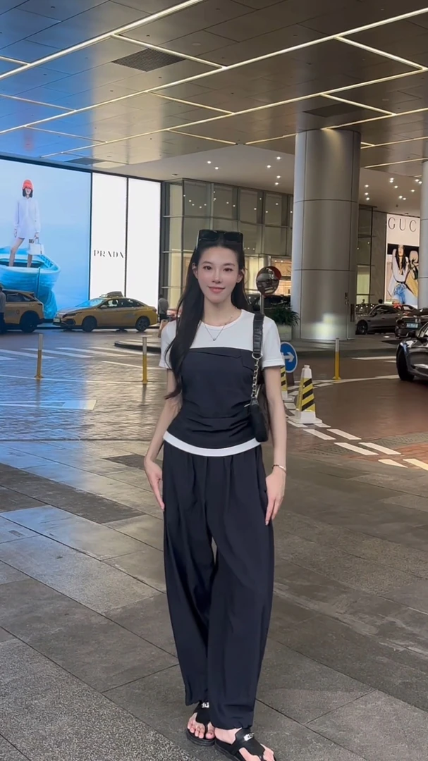 慵懒风套装女夏季2025新款休闲时尚设计感假两件拼接上衣阔腿裤子