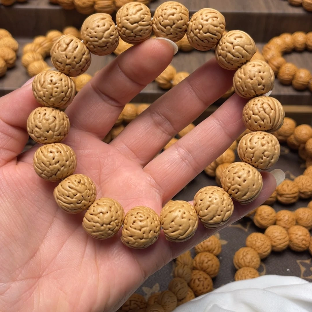 桃核手串爱****、精品金丹