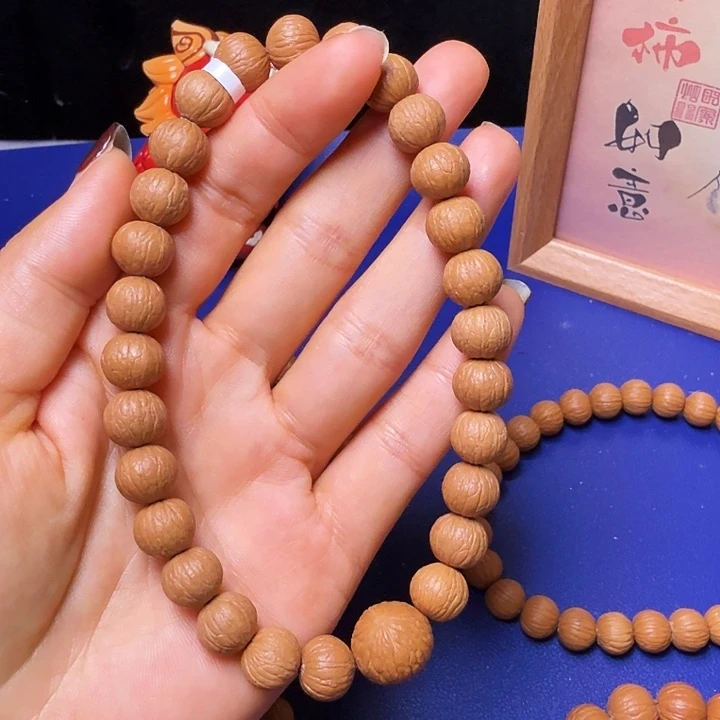 憧***5猴头核桃手串凤羽