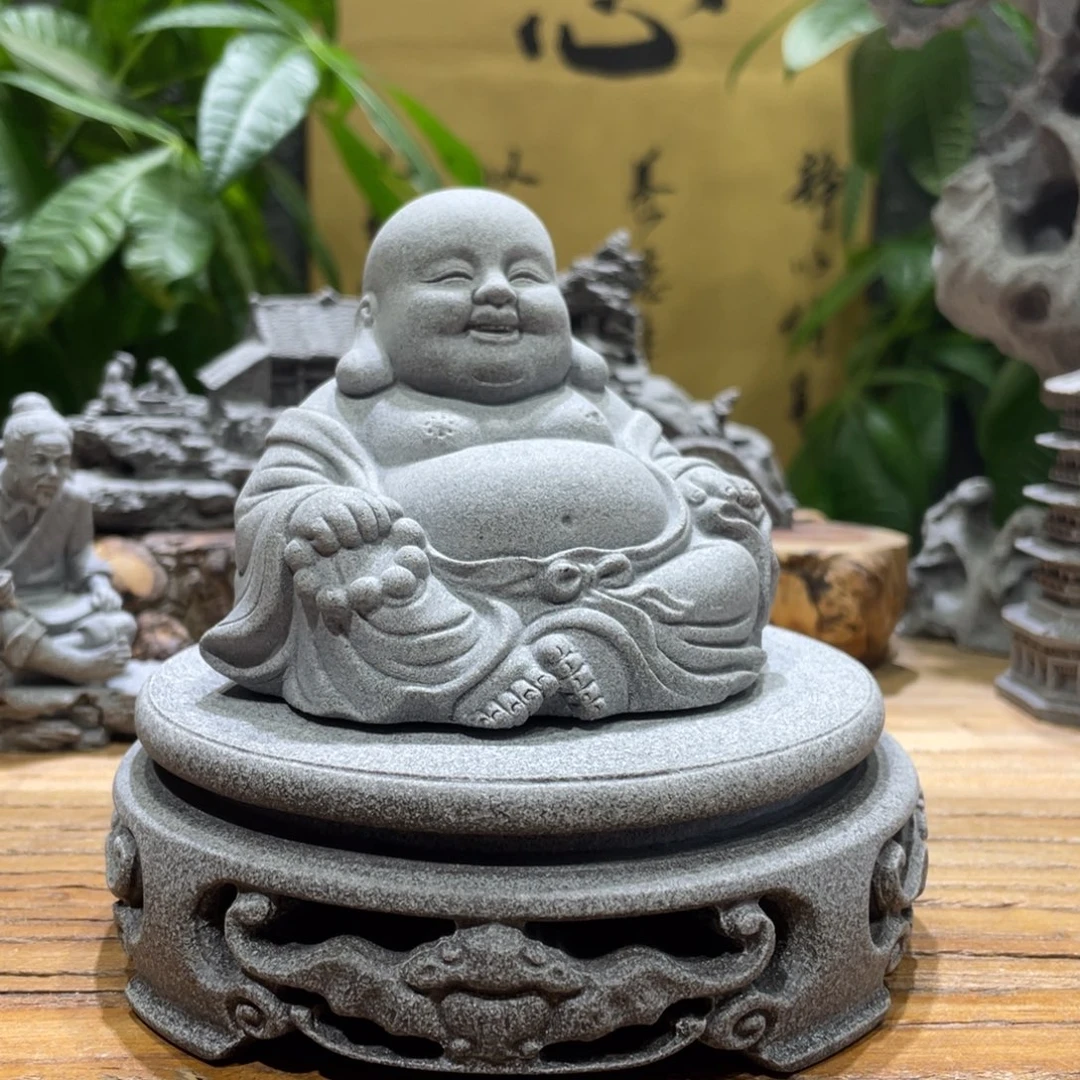 石材圆桌一个大肚弥勒佛一个