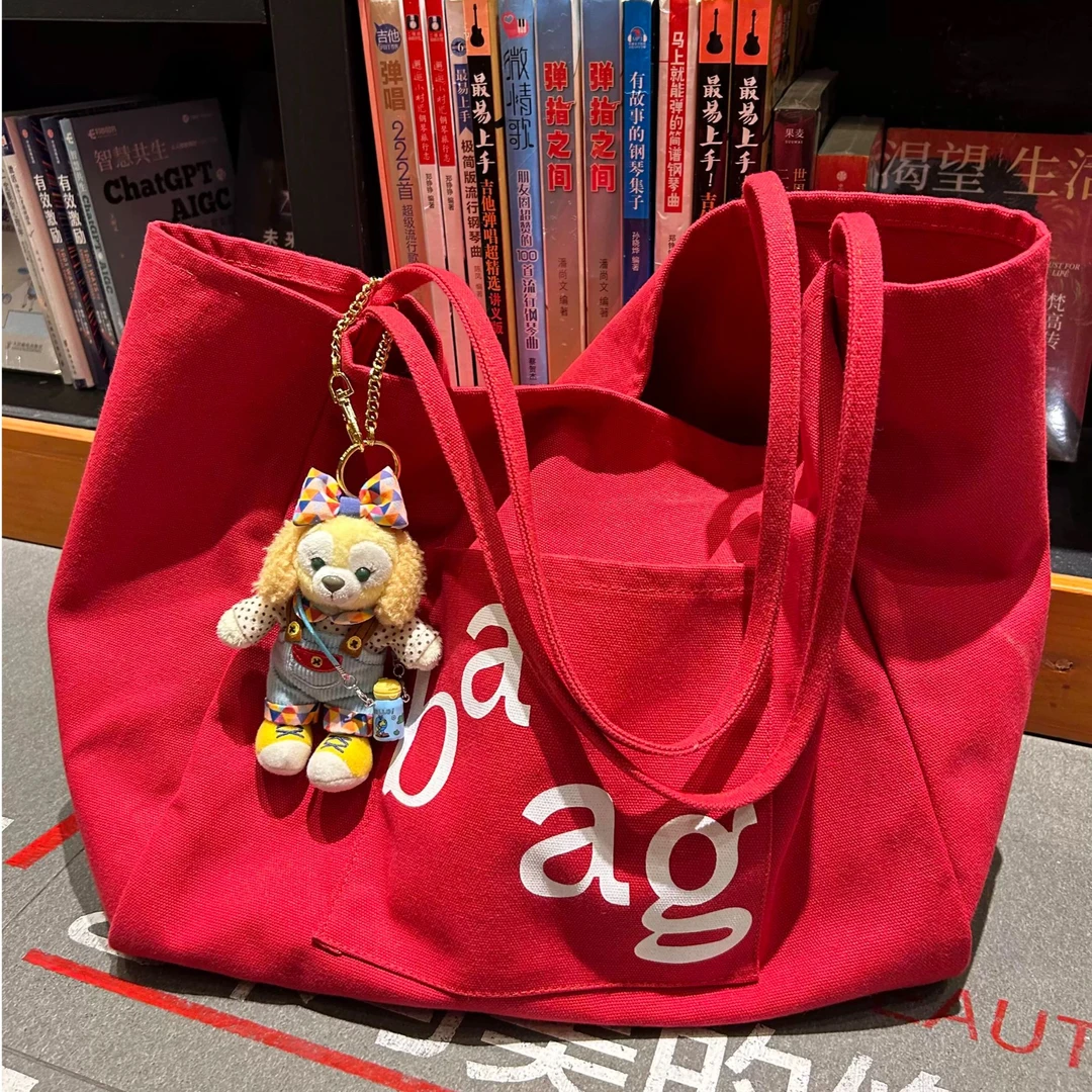 韩系慵懒风大容量红色字母帆布包2025新款百搭学生上课通勤托特包