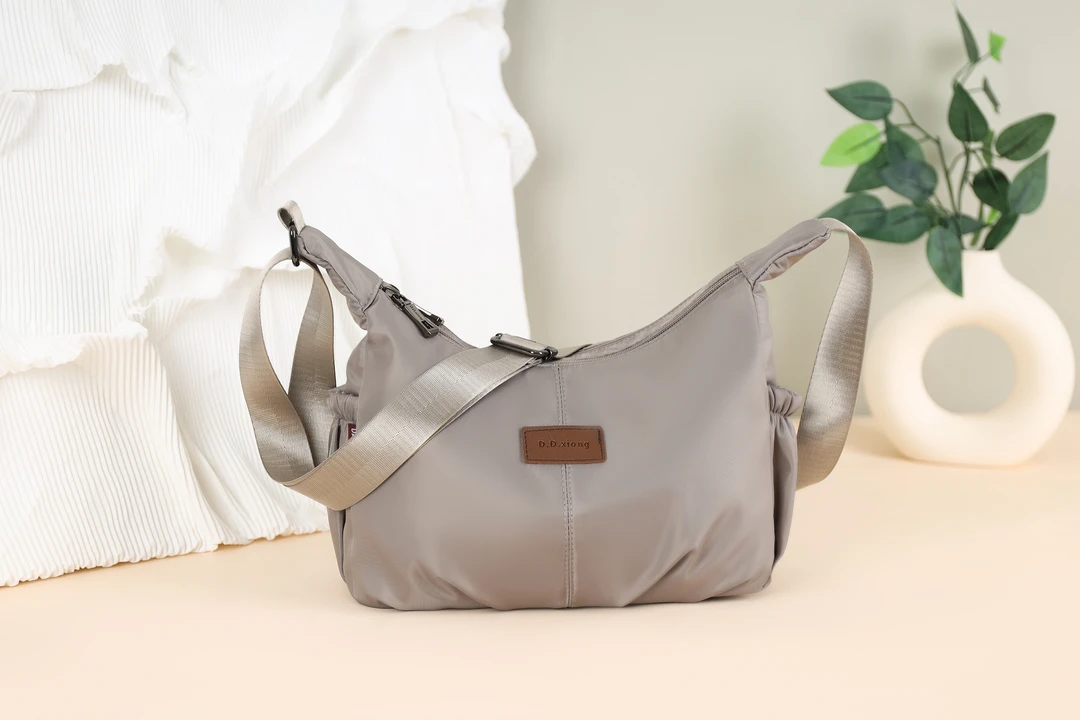 运动风椭圆形单肩可调节斜挎包夏季运动布包休闲包轻便肩包