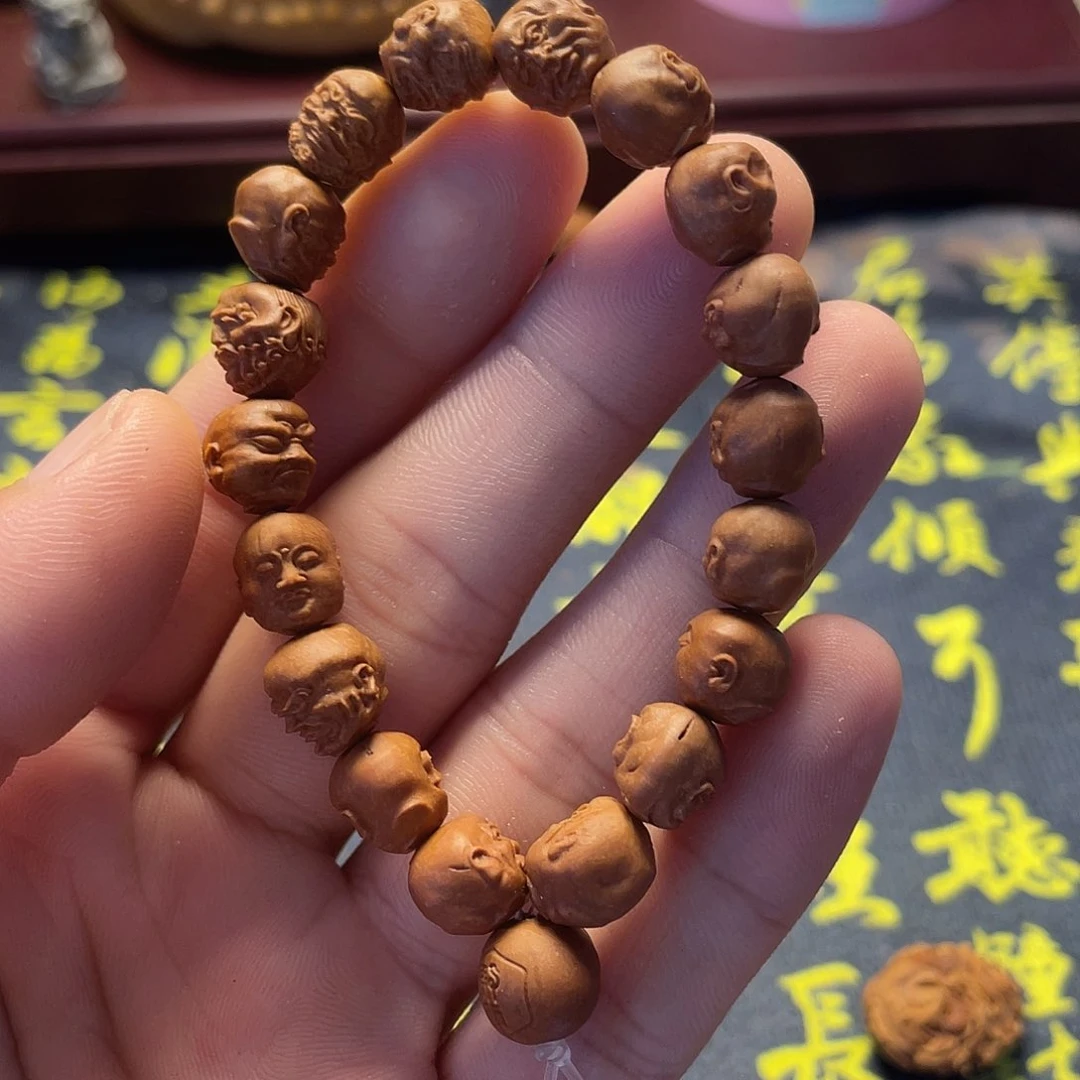 爱****龙纹桃核雕刻瑕疵罗汉