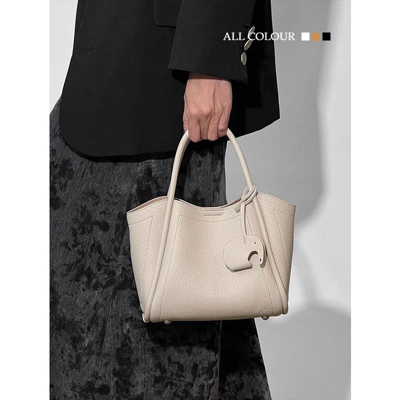 大容量白色手提菜篮子包包女式2025新款高级感单肩斜挎水桶包春季